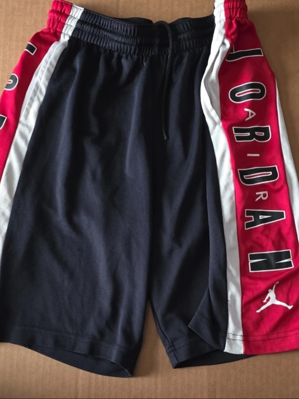 Jordan Black Athletic Shorts with Red Side Panels and White Trim